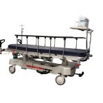 HPA480A Electric Patient Trolley with both side rails raised and a patient monitor on the foot end monitor board